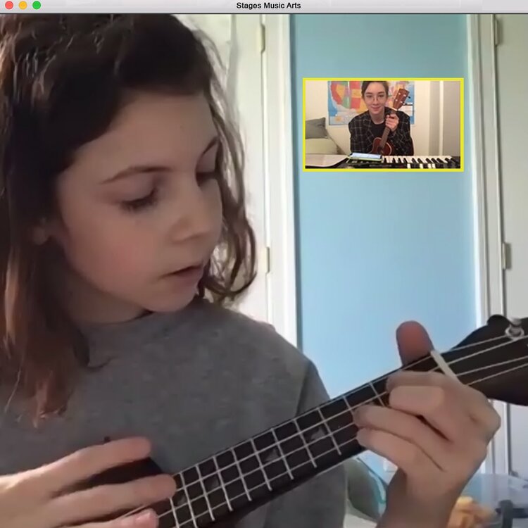Girl plays ukulele during a virtual lesson